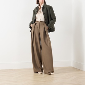 Model wearing Marella turtledove silk-blend shirt with wide-leg taupe trousers and dark green cropped jacket.
