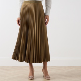 Model wearing Marella Oil Green pleated midi skirt in satin finish, styled with white top and nude heels