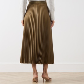 Model wearing Marella oil green pleated midi skirt in satin finish, styled with white knit top and nude heels, rear view.