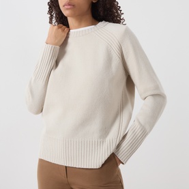 Model wearing Marella turtledove wool crew neck jumper with ribbed cuffs and hem, styled with tan trousers.