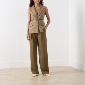 Model wearing Marella Oil Green wide-leg wool trousers, styled with a matching sleeveless blazer and cream pointed-toe flats.