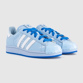 Adidas Superstar trainers in light blue patent leather with white three-stripe detail, royal blue laces and blue sole