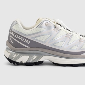 Salomon trainer in Vanilla Ice Silver Lilac, mesh and overlay upper, chunky ridged outsole, close-up side profile shot.
