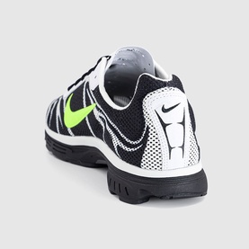 Nike trainer in black, volt and summit white colourway, mesh upper with volt swoosh logo, black rubber outsole, rear three-quarter view.