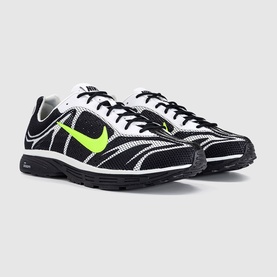 Nike trainers in black, volt and summit white with bold neon green Swoosh, mesh upper and dark rubber sole, pair shown together.