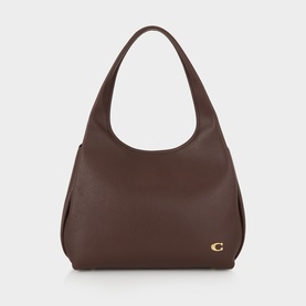 Coach leather shoulder bag in Maple brown with single top handle and gold C logo hardware