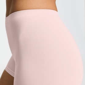 Model wearing Hanro Rosewater seamless shorts, close-up showing smooth fabric and high-rise waistband detail