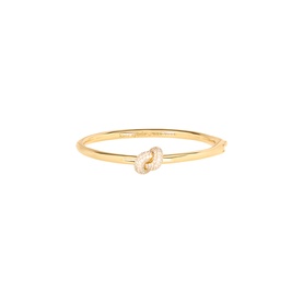 Kate Spade gold bangle bracelet with cubic zirconia knot detail centrepiece, polished finish, hinge closure