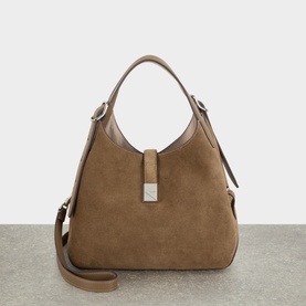 Kate Spade Driftwood leather crossbody bag with suede front panel, single top handle, silver-tone hardware, and detachable shoulder strap