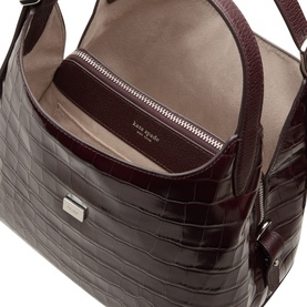 Kate Spade Blackberry Jam leather crossbody bag, open view showing zip interior pocket and beige lining, croc-embossed finish