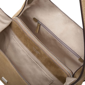 Kate Spade Driftwood leather shoulder bag interior, showing suede-lined compartments, zip pocket, and silver-tone hardware detail.