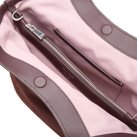 Kate Spade Blackberry Jam leather tote interior, showing pink lining, silver zip pocket, and O-ring hardware detail