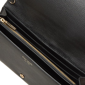 Kate Spade black leather wallet open, showing gold-tone zip compartment and interior card slots