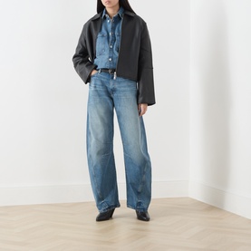 Model wearing Samsoe & Samsoe Sephia Blue wide-leg jeans in 100% cotton, styled with a denim shirt and black cropped jacket.