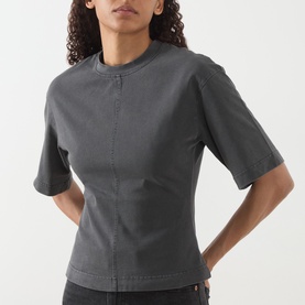 Model wearing Samsoe & Samsoe black pigment cotton T-shirt with mock neck, short sleeves and fitted seam detailing