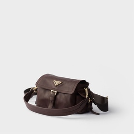 Prada dark brown leather crossbody bag with gold-tone triangle logo, front flap pocket, and adjustable fabric strap
