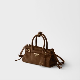 Prada mini duffle bag in brown suede with gold-tone triangle logo hardware, double top handles and adjustable crossbody strap