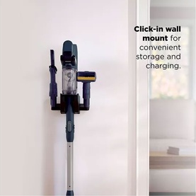 Shark PowerDetect Speed Cordless Vacuum mounted on click-in wall mount for storage and charging, shown in home setting