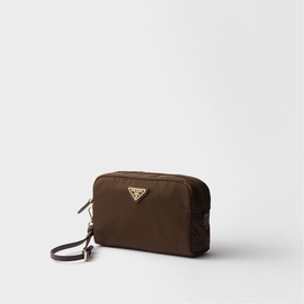 Prada dark brown nylon cosmetic pouch with gold-tone triangle logo plaque, zip closure, and wrist strap