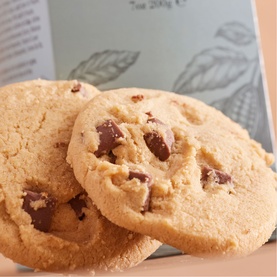 Cartwright & Butler chocolate chip cookies, golden baked with chunky chocolate pieces, shown with branded box in background
