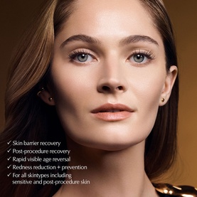Model with Estee Lauder Re-Nutriv Age Reversal Recovery Cr&egrave;me, showcasing radiant, smooth skin with gold-toned campaign backdrop