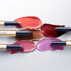 Est&eacute;e Lauder Pure Colour Melt-On Shimmerstick in 625 Sparkling Mocktail, four lip gloss sticks with coral, red, pink and lilac swatches