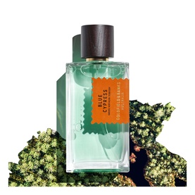 Goldfield & Banks Blue Cypress EDP in clear rectangular bottle with dark wood cap, displayed against cypress foliage backdrop
