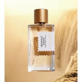 Goldfield & Banks Ingenious Ginger Eau de Parfum, clear rectangular bottle with wooden cap, set against warm golden landscape backdrop