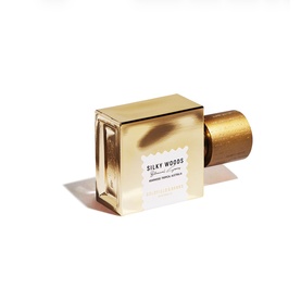 Goldfield & Banks Silky Woods Eau de Parfum in gold square bottle with cylindrical wooden cap