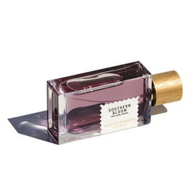 Goldfield & Banks Southern Bloom EDP in a mauve glass bottle with gold wooden cap, shown on its side