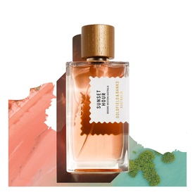 Goldfield & Banks Sunset Hour Eau de Parfum, amber glass bottle with gold cap, styled with coral and teal brush stroke backdrop