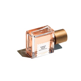 Goldfield & Banks Sunset Hour Eau de Parfum in a square glass bottle with warm peach tint and gold hammered metal cap.