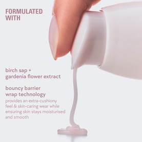 Kylie Cosmetics Makeup Primer being poured, showing smooth milky texture with birch sap and gardenia flower extract formula details