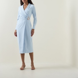 Model wearing Lavish Alice Blue Wrap Midi Dress with gold buckle detail, long sleeves, styled with nude heeled sandals