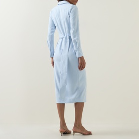 Model wearing Lavish Alice blue midi shirt dress with tie waist belt, shown from the back, styled with nude heeled mules.