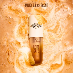 Sol De Janeiro Leite Caf&eacute; Perfume Mist bottle surrounded by swirling golden coffee milk texture, milky and rich scent