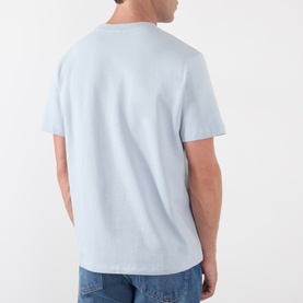 Model wearing A.P.C. T-Shirt in light blue cotton, rear view, styled with blue jeans