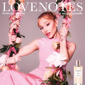 Ariana Grande Lovenotes Pink Woods EDP bottle displayed beside Ariana Grande in a pink dress surrounded by pink roses