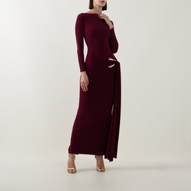 Model wearing Club London Burgundy maxi dress with long sleeves, cut-out waist detail and wrap tie, paired with nude heels.