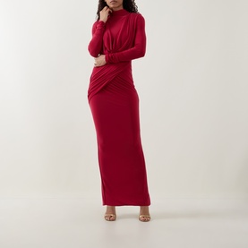 Model wearing Club London red long-sleeve maxi dress with high neck and ruched waist detail, styled with nude heeled sandals