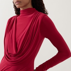 Model wearing Club London red long-sleeve draped cowl-neck dress in stretch jersey fabric, close-up detail view
