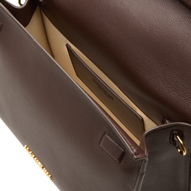 Jacquemus Midnight Brown leather clutch, open interior view showing cream cotton lining, card slot and gold-tone hardware detail