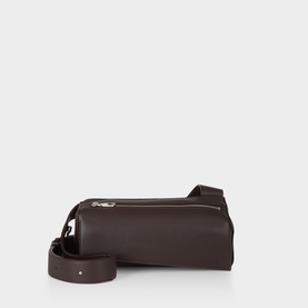 Loewe Puzzle Featherlight Sling Bag in dark chestnut grained lambskin, geometric silhouette, top zip closure, silver-tone hardware, with crossbody