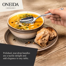 Oneida Barcelona stainless cutlery set, spoon resting in a bowl of soup on a rustic table with bread roll