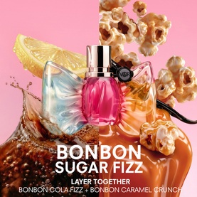 Viktor & Rolf Bonbon Sugar Fizz EDP in pink bottle styled with cola, lemon and caramel popcorn, promoting a layering fragrance set