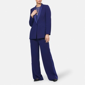 Model wearing Helen McAlinden Ink Blue wide-leg trousers, styled with matching blazer and camisole