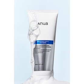 Anua Hyaluronic Acid & Panthenol Cleansing Gentle Foaming Cleanser tube in white and blue with foamy lather surrounding it
