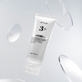 Anua 3+ Day/Night Cream in white tube with floating glass disc elements on light grey background