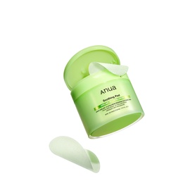 Anua Toner in open green jar with one textured pad removed, showing pale green gel formula inside the lid.