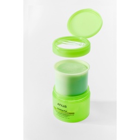Anua toner in neon green lidded jar with open lid showing green gel formula inside, compact cylindrical pack format